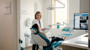 Dentist reviewing dental consultation with patient